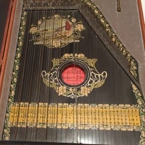 Antique Guitar Thither
